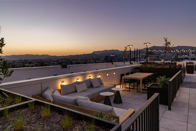 Roof top amenity lounge with view of the Hollywood hills 