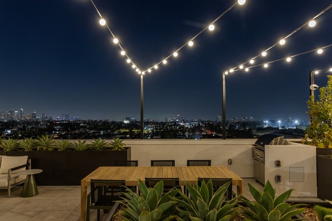 Rooftop outdoor amenity space with views of Los Angeles